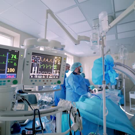 the doctor with the artificial life support medical equipment. hospital, surgical operating room. life saving. ventilation of the lungs with oxygen.