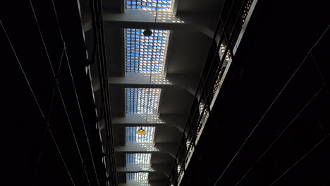 Alcatraz-Prison-Detail,-Glass-Ceiling-and-Gallery-in-Cellhouse,-Low-Angle