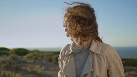 inspired woman walking mountain closeup. happy girl enjoying evening sunlight