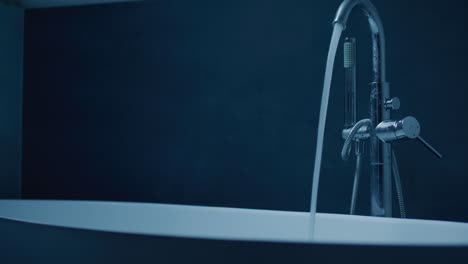 modern bathtub filling with water