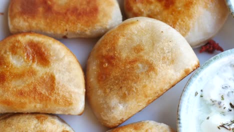 fried pierogi with sour cream dip