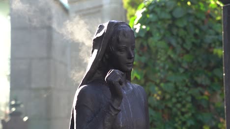 Cemetery-statue-steams-in-the-first-rays-of-sunshine-of-the-day