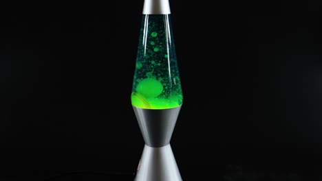 green lava lamp with moving wax blobs