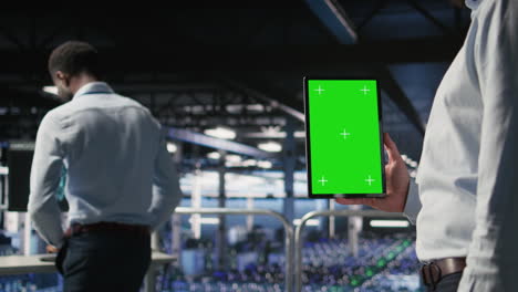 close up of data center admin using mockup tablet to update software