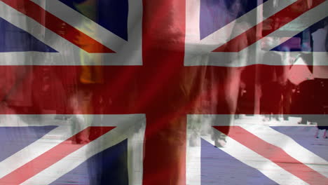 union jack with people walking in an crowded street