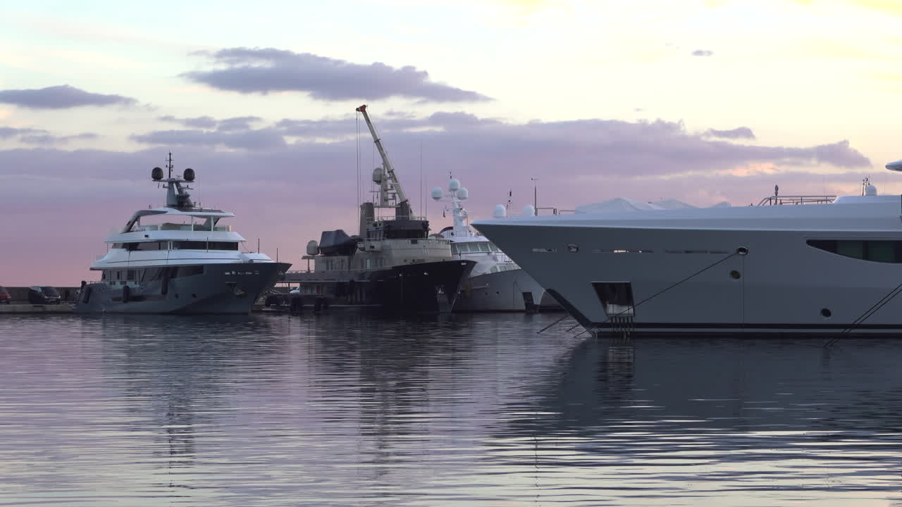 Antibes, France - March 21, 2025: Multiple boats docked in the port in the evening