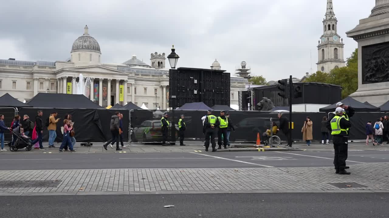 Police Officers and Crowd in Trafalgar Square, London