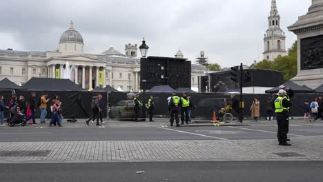 police officers and crowd in trafalgar square, london
