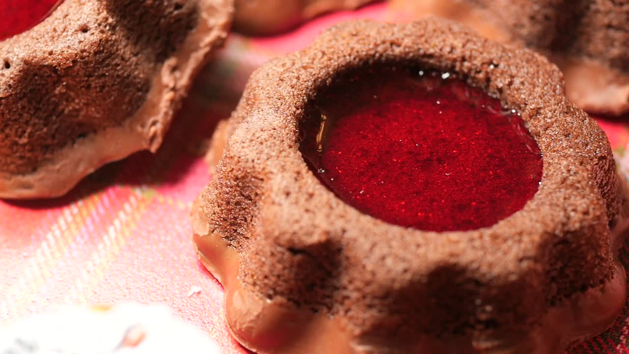 Close-up of Chocolate Cookies with Red Filling