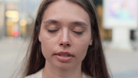 portrait of young caucasian woman crying