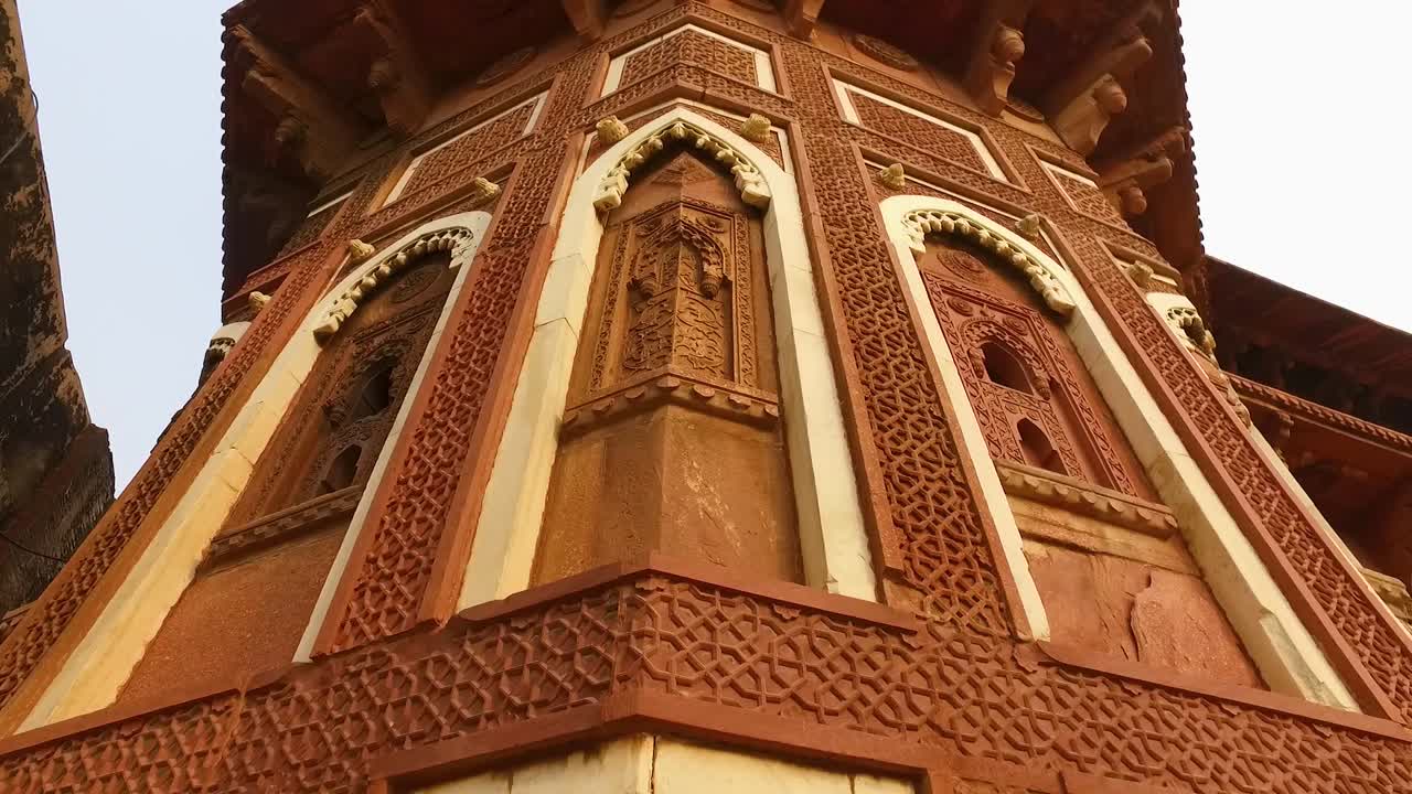 Corner Column of Jahangir Palace in Agra, India with Creative and Artistic Carvings on the Walls