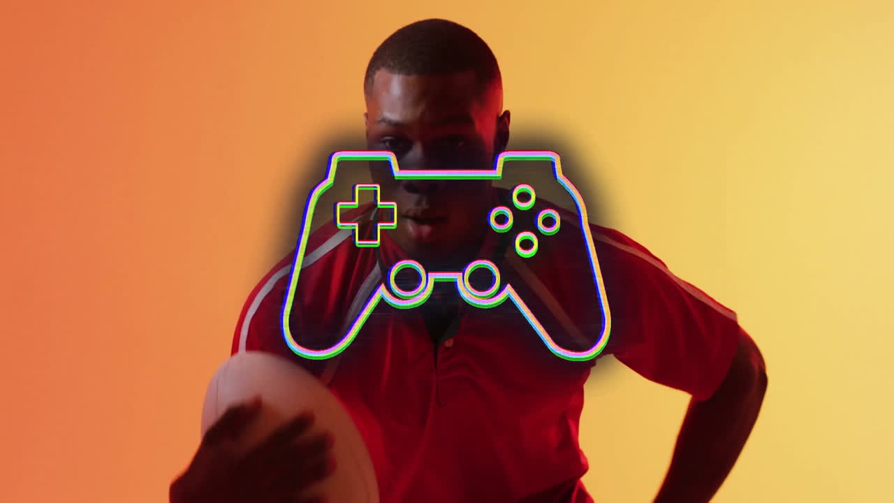 Holding rugby ball, person with game controller animation on orange background