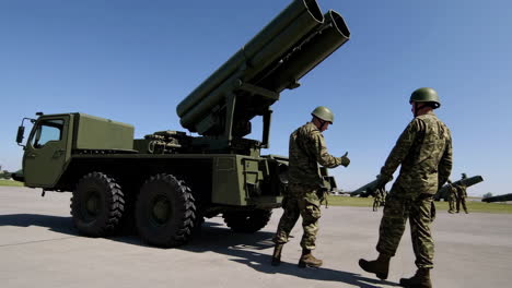 Military Personnel Working on Missile Launcher