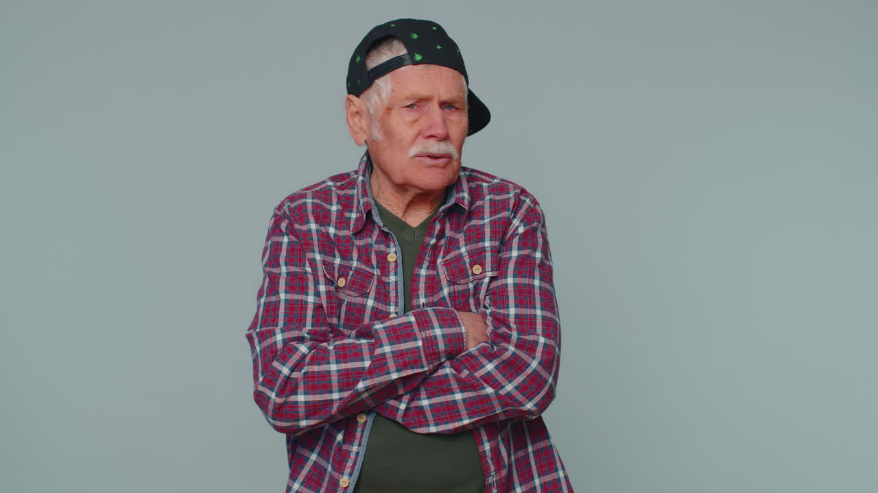 Offended senior elderly man frustrated after quarrel, ignores and does not want to communicate, talk