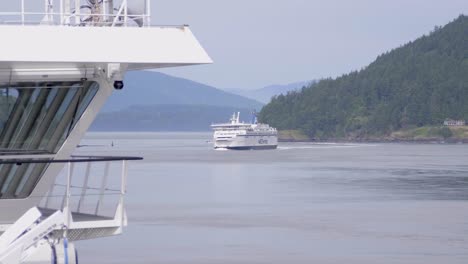 Ferry-Boats-Navigating-On-A-Foggy-Daytime-With-Dense-Forest-Mountain-At-Background