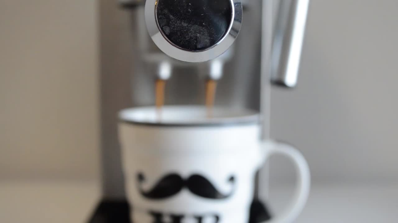 Making coffee on an espresso machine.