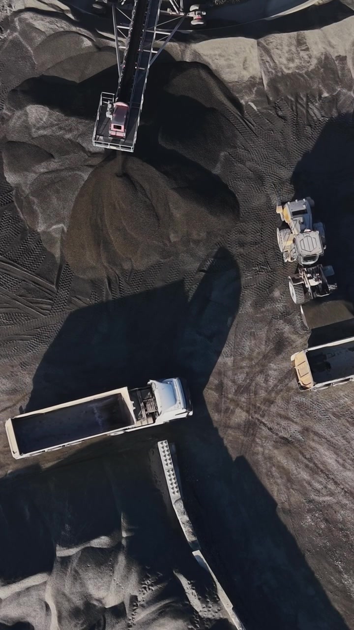 Quarry site showing trucks and mining equipment in operation