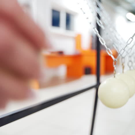 Balancing balls of Newton's cradle. Museum of Science