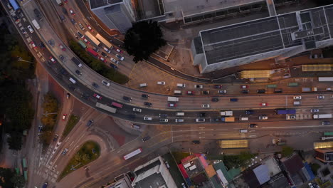 hong kong evening traffic jam, highway, busy roads, kwun tong bypass, crowded freeway, rush hour, cars, buses, taxis, vehicles, topdown panoramic view, 4k drone, urban city landscape, overpopulation