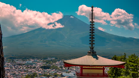 Fuji-mount-and-Chureito-pagoda-buddhist-temple-at-Japan-zoom-in-moving-timelapse-clouds-blue-sky