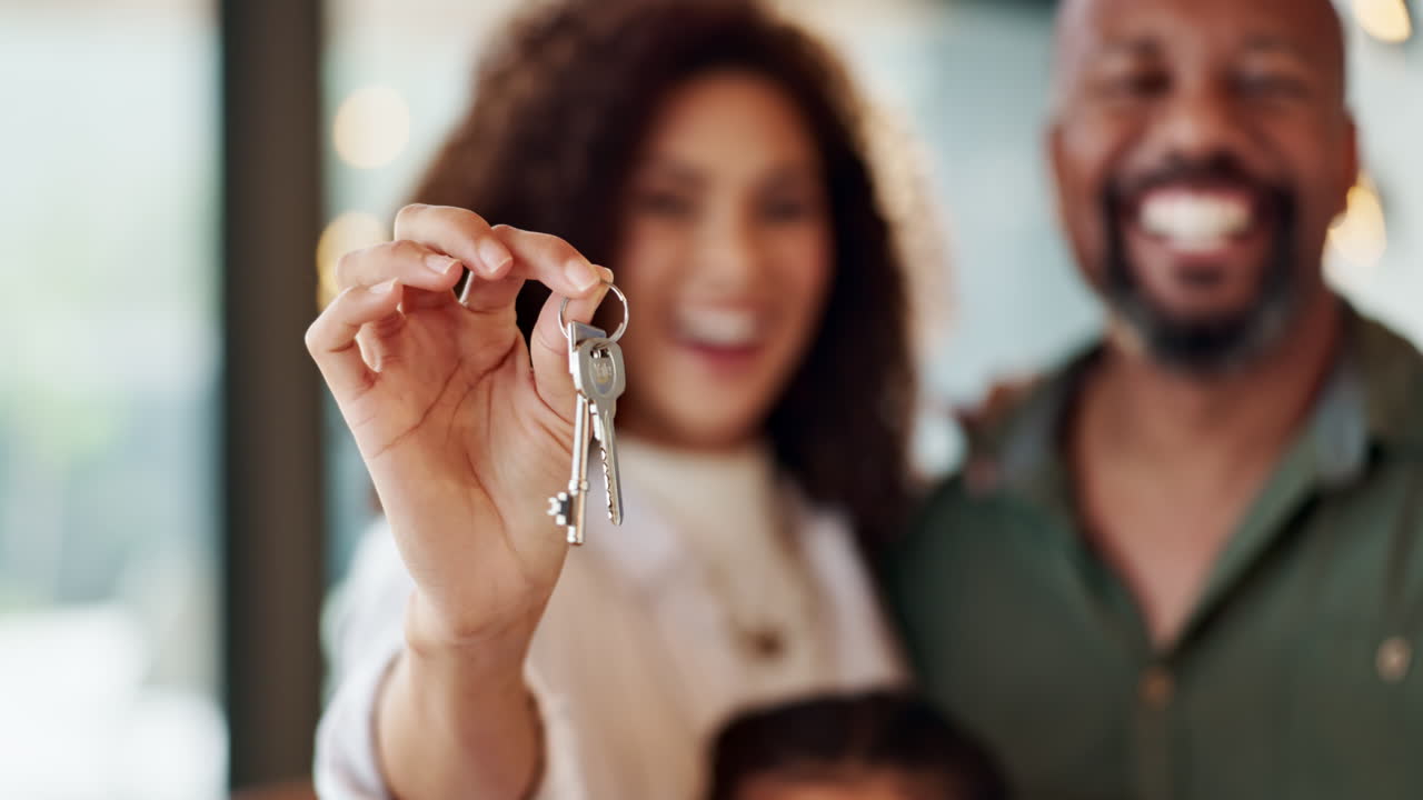 Family celebrates new home purchase with keys