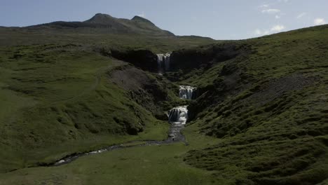 aerial of popular tourist attraction sheeps waterfall in iceland, selvallafoss