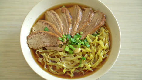 egg noodles with stewed duck in brown soup - asian food style-2