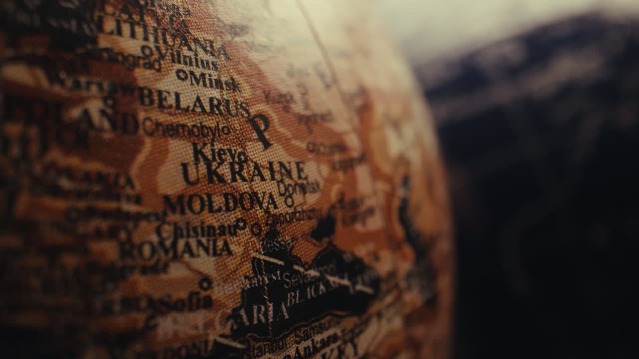 Close-up of a vintage globe, focusing on Ukraine and surrounding countries.