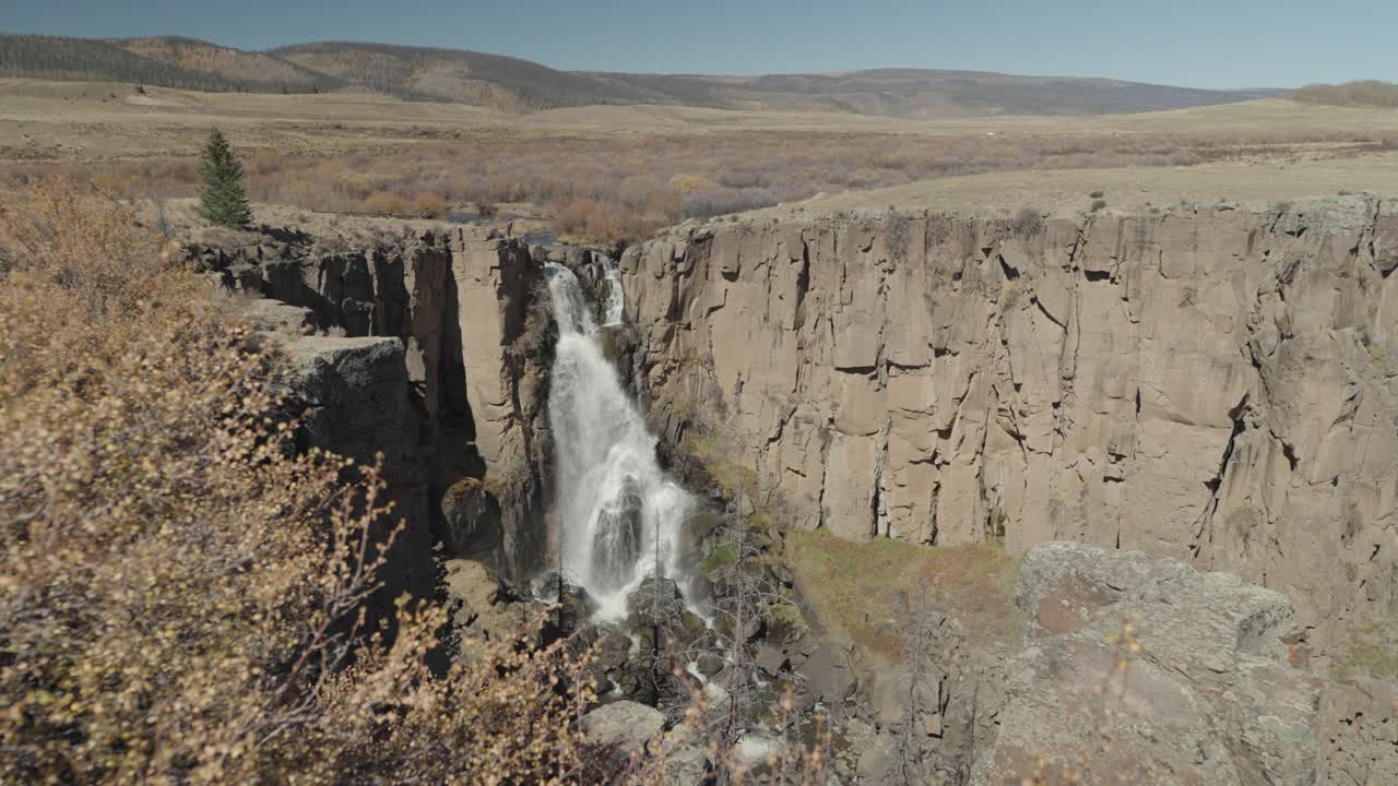 Scenic Waterfall in Rocky Canyon Landscape