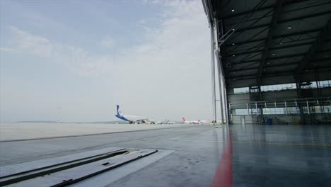 airport hangar with aircraft