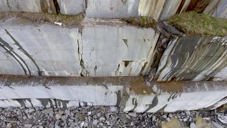 aerial camera move down on giant marble blocks in the quarry