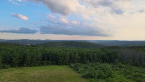 a cloudy sunset over the rolling hills of owego new york