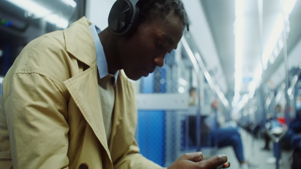 Man with Headphones on Subway Train