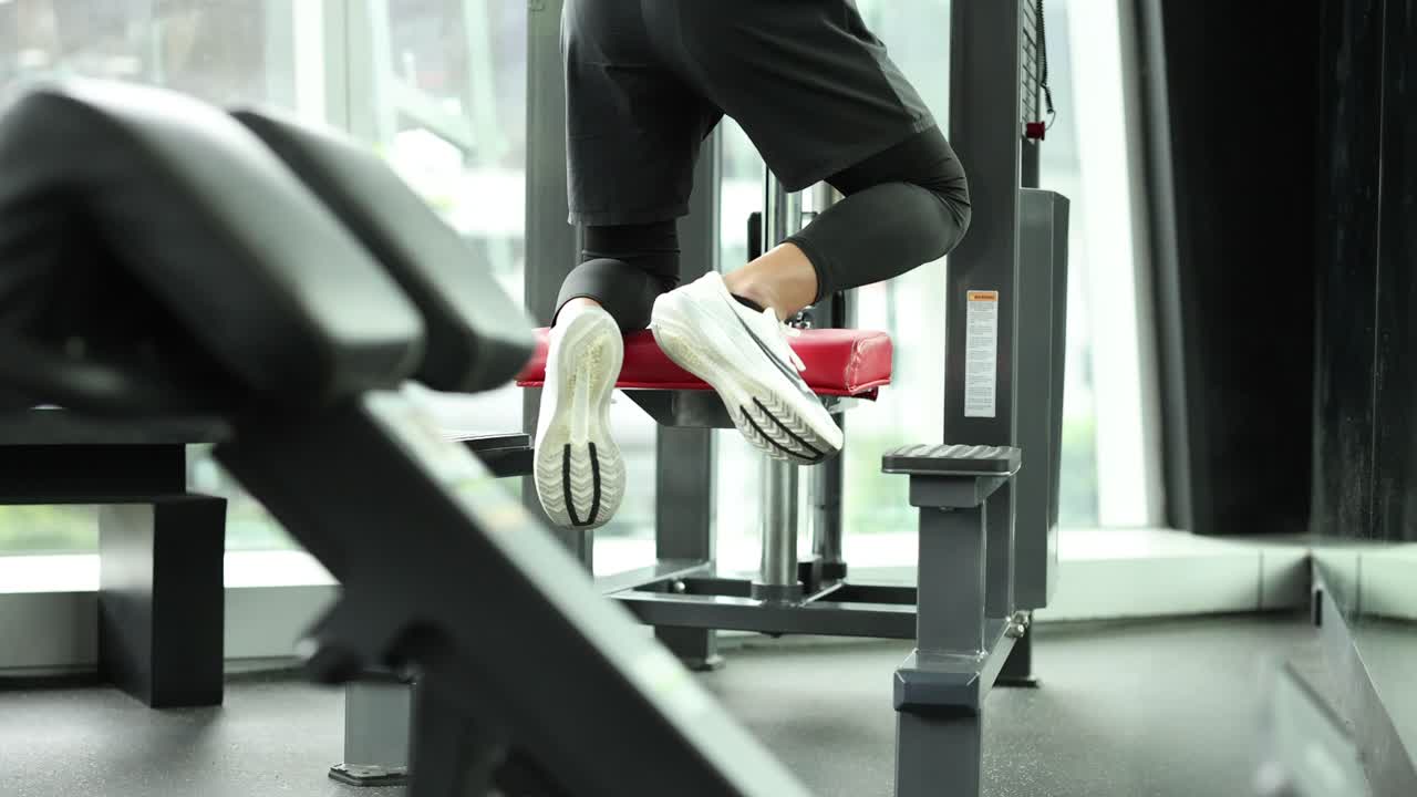 Person using machine for assisted pull-ups