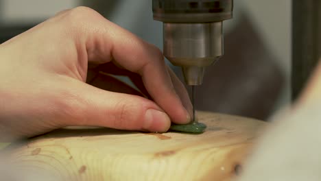 Detail-of-drilling-small-hole-into-a-green-stone-from-New-Zealand---Slow-Motion