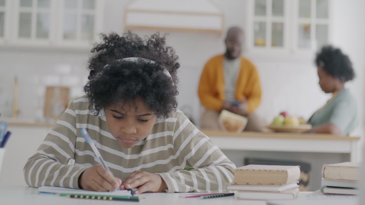 Child Doing Homework in Kitchen