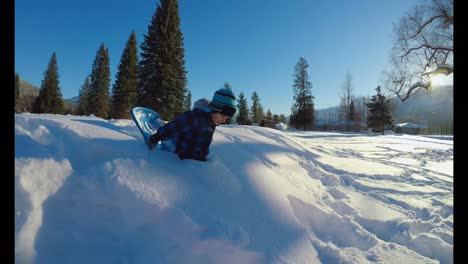 Kid-playing-in-the-snow-during-winter-4k