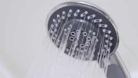 close-up of water drops in the shower head.