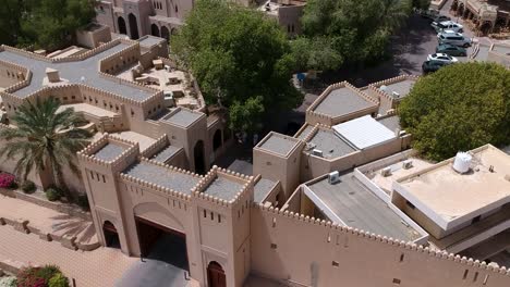 aerial of nizwa with historic fort and walls in the sultanate of oman