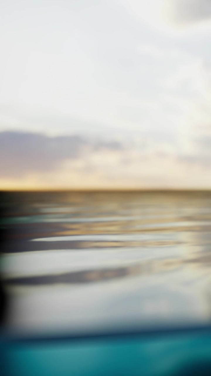 Water surface reflects clouds and sky during a calm afternoon