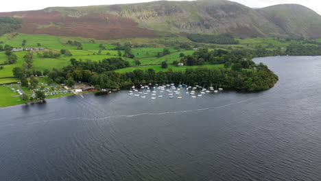 aerial footage over ullswater lake towards boatyard harbour