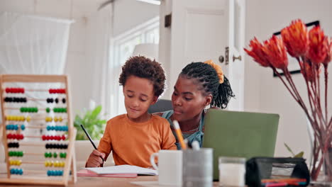 mother helping child with homework at home
