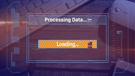 Animation-of-loading-over-digital-screen,-mouse-and-keyboard-on-desk