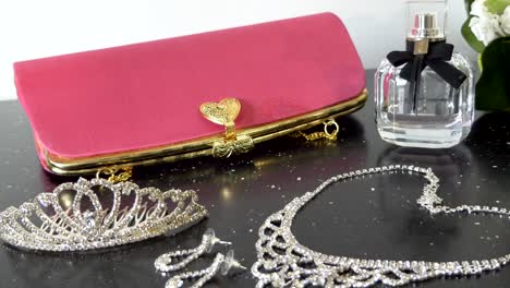 closeup shot of woman purse, handbag, necklace, ear ring and wedding accessories