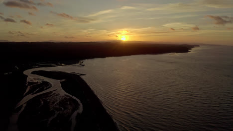 aerial view of sunset over ocean coast
