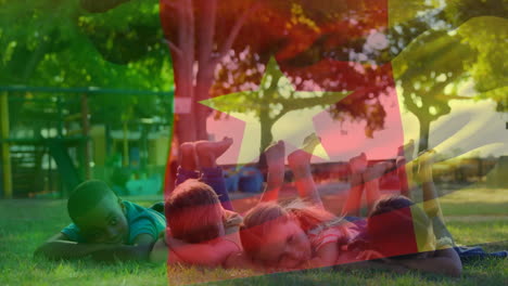 on grass in park, children with colorful star animation overlay, relaxing together