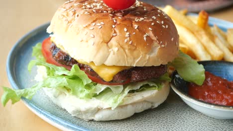 close-up of a delicious cheeseburger with fries and ketchup