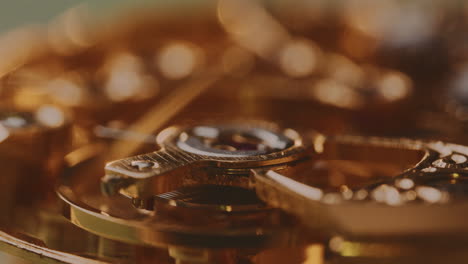 movement of mechanism inside mechanical gold watch