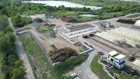 yard waste disposal pile at garbage centre with covered compost, aerial