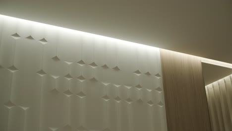 modern interior wall design with wood paneling and lighting